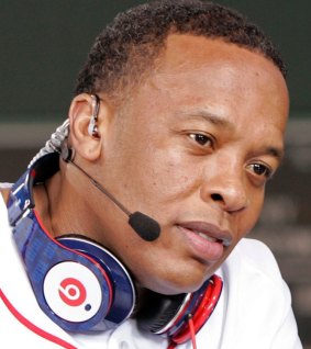 Sound off: Dr Dre wearing a pair of Beats headphones.