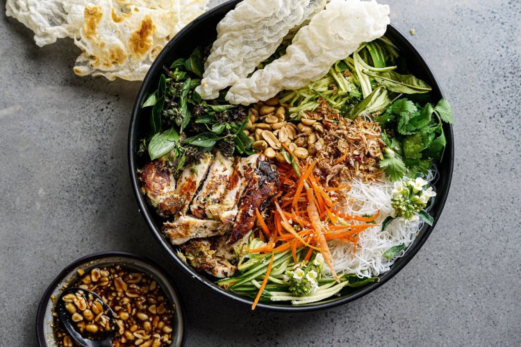 Charred lemongrass chicken spring roll bowls with chunky peanut hoisin dressing. 