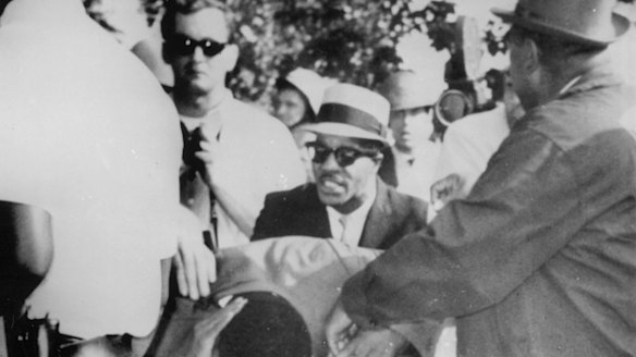 Dr Martin Luther King jnr holds his head after being struck by a rock as he was leading about 600 demonstrators on a civil rights march through a Chicago neighbourhood in 1966.