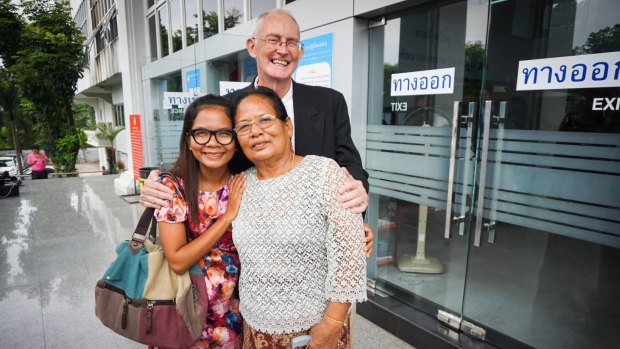 Alan Morison and Chutima Sidasathian with family and supporters after their acquittal.