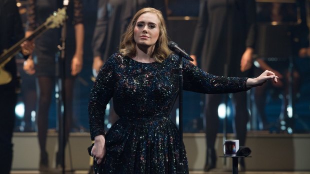 Adele, pictured performing in Paris, says she was asked to perform at the Super Bowl.