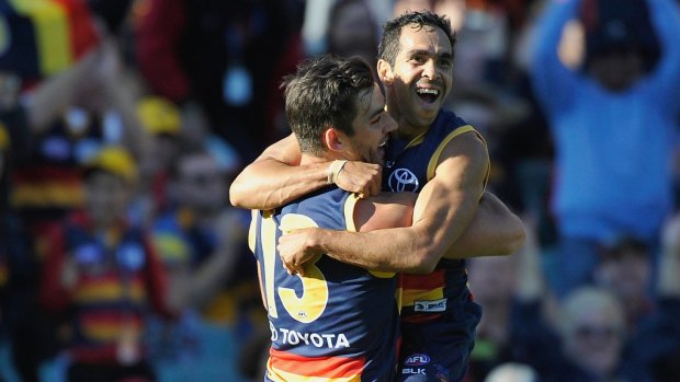 Eddie Betts and Taylor Walker celebrate a goal.