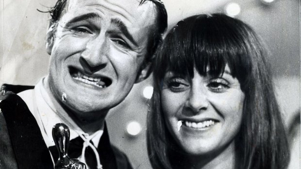 Norman Gunston (alias Garry McDonald) with Denise Drysdale with his Logie.