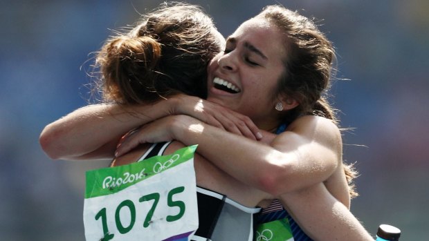 Respect: Abbey D'Agostino, right, hugs Nikki Hamblin. 