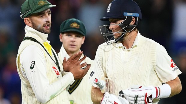 Nathan Lyon has words with England captain Joe Root during the tense second Test at the Adelaide Oval.