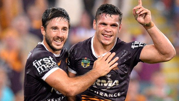 Ben Hunt and James Roberts of the Broncos celebrate a try during the round eight NRL match between the Brisbane Broncos and the South Sydney Rabbitohs at Suncorp Stadium. 