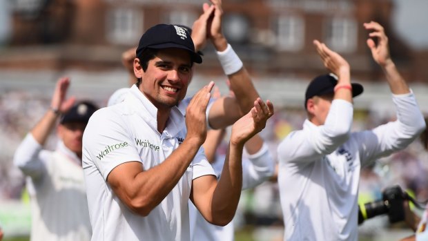 Relief: Alastair Cook celebrates with England teammates after regaining the Ashes at Nottingham.