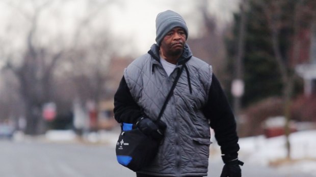 James Robertson, 56, of Detroit. Getting to and from his factory job more than 30 km on foot.