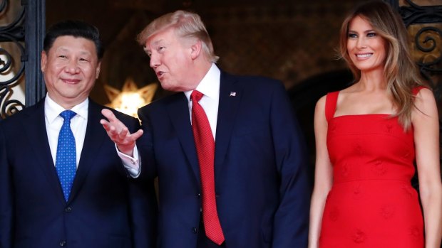 Mrs Trump, right, with her husband US President Donald Trump and Chinese President Xi Jinping.