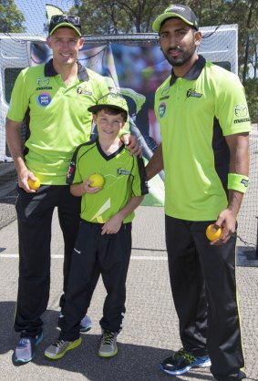 Lime time: Ahillen Beadle (right), Mike Hussey and a young supporter at a Sydney Thunder fan day. 