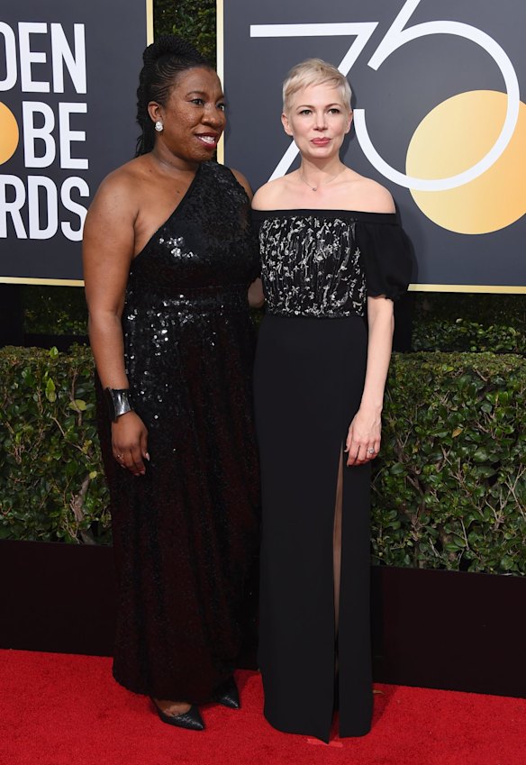 Me Too activist Tarana Burke, left, with Michelle Williams at the 75th annual Golden Globe Awards.