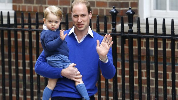 It's a girl: William, the Duke of Cambridge and his son Prince George wave outside St. Mary's Hospital's Lindo Wing on Saturday.