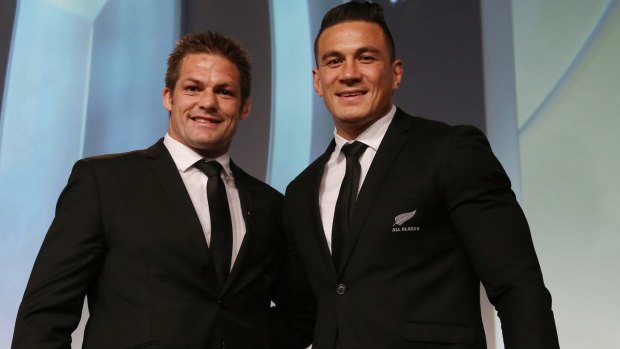 Former teammates: Richie McCaw presents Sonny Bill Williams with his replacement medal on Sunday, after he gave his original medal to All Blacks fan Charlie Line. 