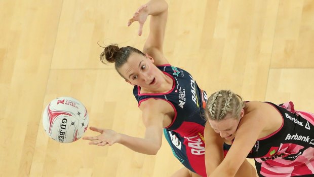 Emily Mannix of the Vixens and Sasha Glasgow of the Thunderbirds compete for the ball at Margaret Court Arena last round.