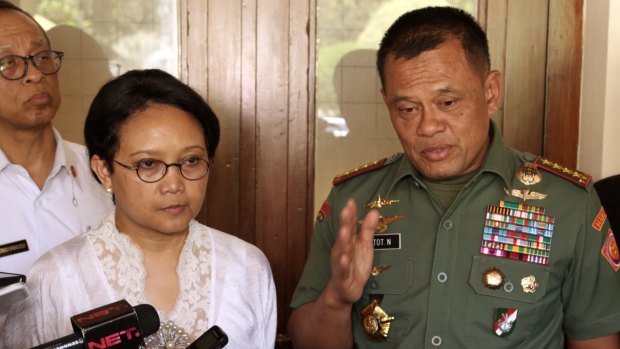Indonesian Armed Forces Chief General Gatot Nurmantyo, right, speaks to the media as Foreign Minister Retno Marsudi, second left, listens in 2016.
