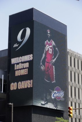 All is forgotten: A large electronic billboard in Cleveland welcomes back LeBron James on July 11 after he announced he would return to the Cleveland Cavaliers after four years with the Miami Heat.
