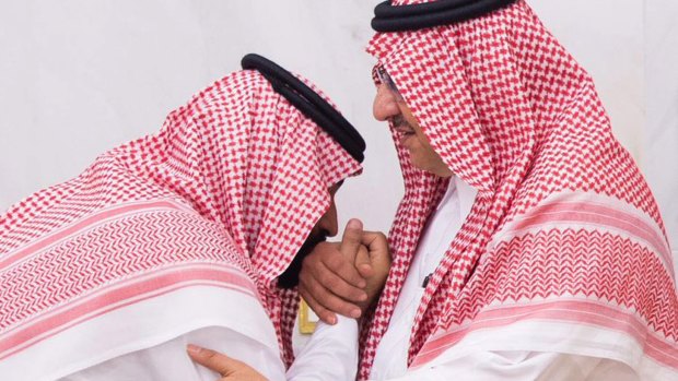 Newly appointed Saudi Arabian crown prince Mohammed bin Salman (left) kisses the hand of former heir Mohammed bin Nayef.