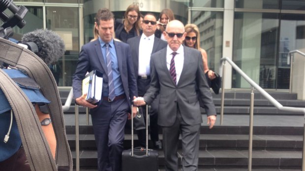 Frank Delli-Benedetti, centre, was fined $5000 and given a spent conviction over a 2011 indecent assault. His lawyer Tom Percy QC, right.