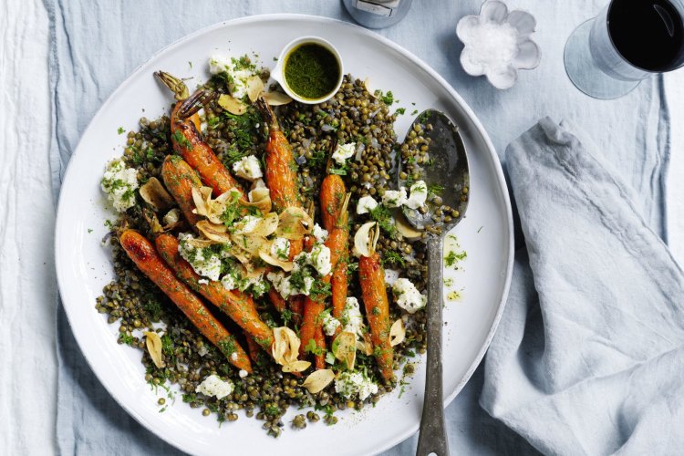 Whole roast carrots with lentils, goats curd and garlic chips.
