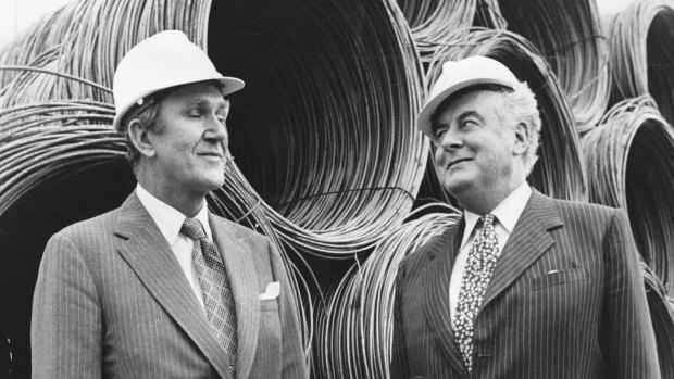 Hard hats for hard heads: Malcolm Fraser and Gough Whitlam at the opening of a BHP steel mill in Geelong in 1974.