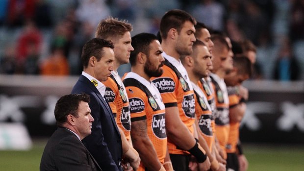 On notice: Jason Taylor lines up with Wests Tigers players before the loss to the Canberra Raiders.