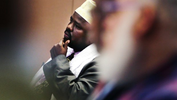 Mahdi Ahmed Ali, vice president of the Somali Council of New England, listens to a video as part of the "Countering Violent Extremism" program in 2015. 