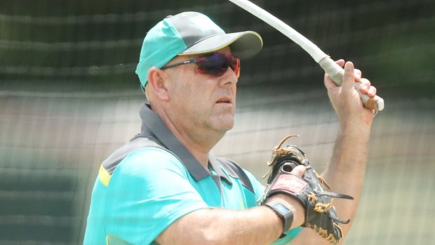 'Let's get positive': Darren Lehmann in the nets at the Allan Border Field during an Australian training session before the opening Ashes Test.