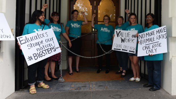 The protesting childcare workers outside 4 Treasury Place.