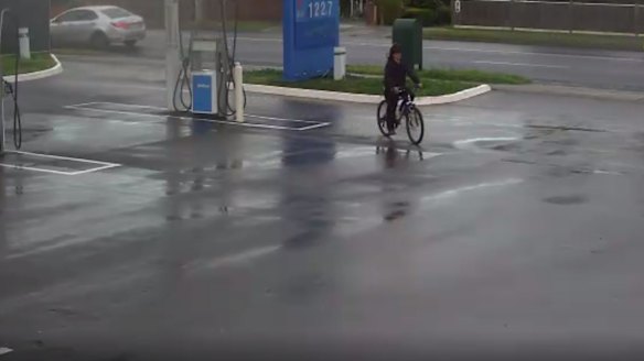 CCTV footage of the man cycling through a petrol station.