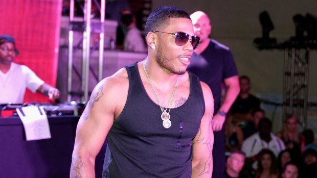 Rapper Nelly, pictured performing in Las Vegas in March, has been arrested in relation to drug and firearm offences.