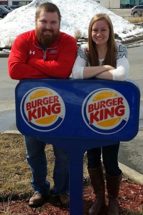 The couple posed in front of a Burger King sign for their engagement announcement.