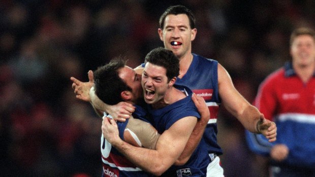 Nathan Eagleton and Rohan Smith of the Western Bulldogs celebrate at the final siren after they defeated Essendon in round 21 in season 2000.