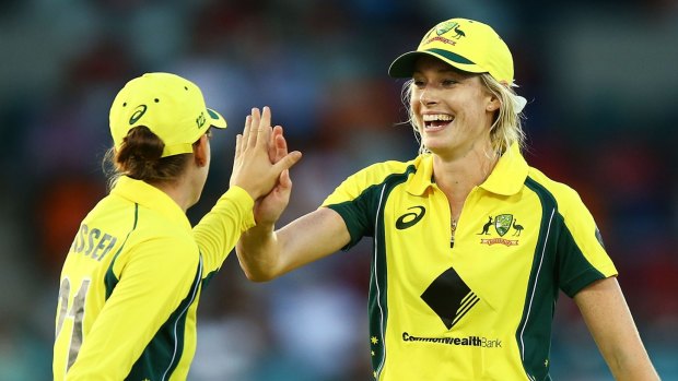 All smiles: Holly Ferling (right) and Jess Jonassen of Australia celebrate a wicket in their win over India.
