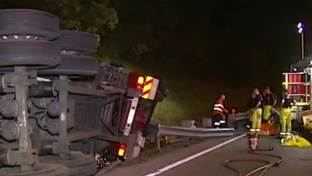A 36-year-old man died on Friday evening after his truck rolled on the Pacific Motorway at Eight Mile Plains and caused heavy delays into Saturday morning.