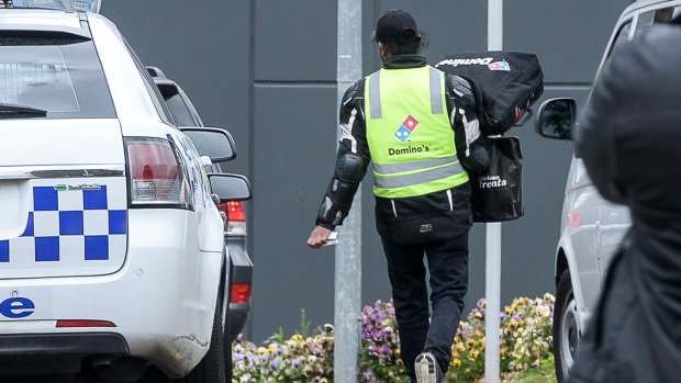  A Domino's Pizza deliveryman delivers an order to the centre on Monday aternoon.