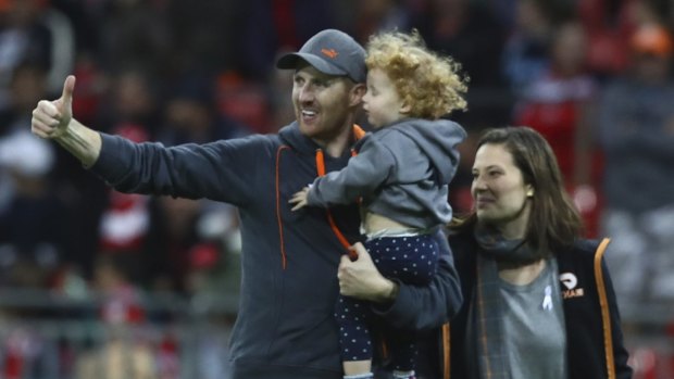 Giant boost: Paul Waterhouse celebrates with wife Beth and Elsie after winning $100,000.