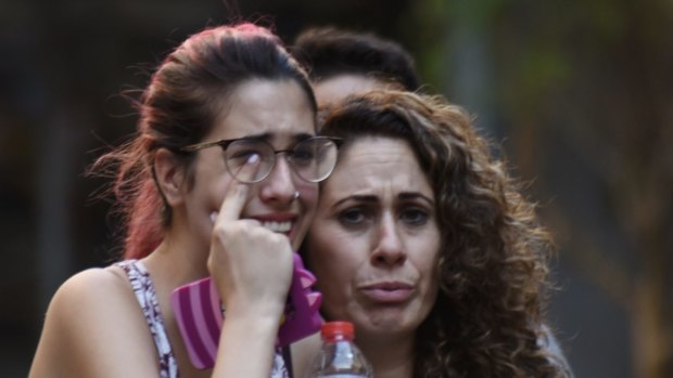 People flee from the scene after the van attack in the historic Las Ramblas district of Barcelona, Spain.