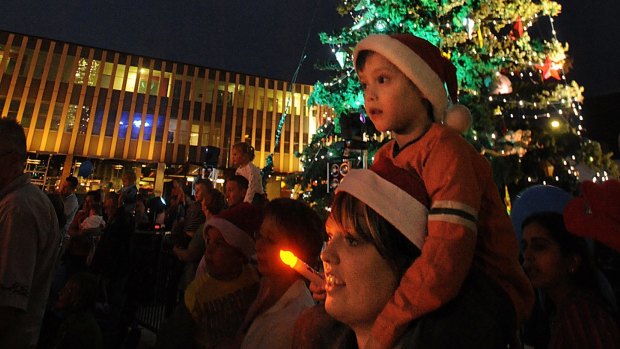 Flashback: Carol Walker and her nephew Owen Walker in front of the Christmas Tree in 2008.