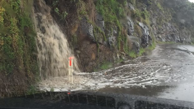 Water gushing across the Great Ocean Road on Wednesday.
