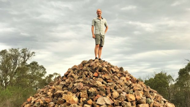 David Osmond of Dickson on the rock cairn atop Gossan Hill.
