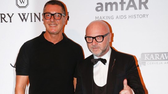 Italian fashion designers Domenico Dolce, right, and Stefano Gabbana pose on the red carpet of The Foundation for AIDS Research (amfAR) event in Sao Paulo, Brazil, Friday, April 15, 2016.