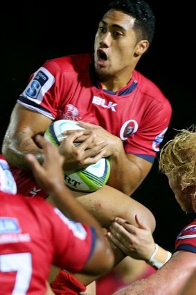 Jamie-Jerry Taulagi of the Reds takes a high ball.