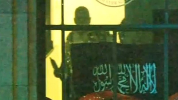 An Islamic State flag was shifted upwards about 7.30, giving officers a better sight.