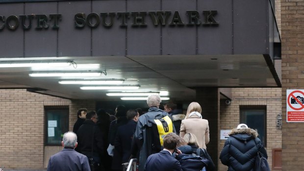 People queue to enter Southwark Crown Court in London for the Rolf Harris trial.
