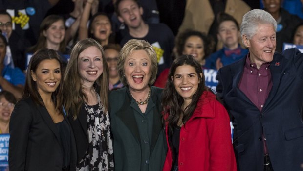 Actresses Eva Longoria and America Ferrera with Hillary Clinton and her family.
