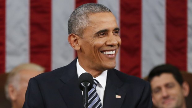 President Barack Obama smiles during his State of the Union address .