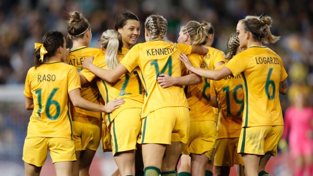 Good as gold: Matildas players celebrate Sam Kerr's goal against Brazil in Newcastle last month.