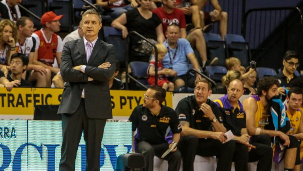 Loss in Wollongong: Damian Cotter looks bemused during the Sydney Kings' loss to Illawarra. His replacement, Joe Connelly, is seated on the bench in between fellow assistant coach Ben Knight and centre Julian Khazzouh.