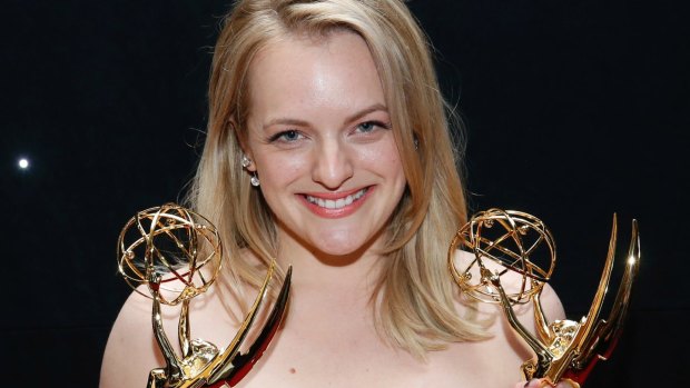 Elisabeth Moss with her awards for outstanding lead actress in a drama series and outstanding drama series for "The Handmaid's Tale" at the 69th Primetime Emmy Awards in 2017.