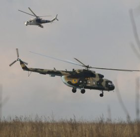 Ukrainian helicopters take off after delivering reinforcements to Kramatorsk. 